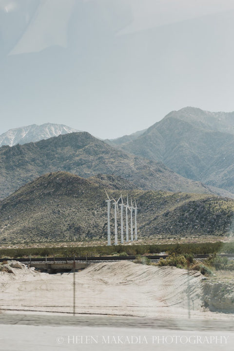 Wind Turbines and Mountains in Palm Springs, captured as a passenger in a car